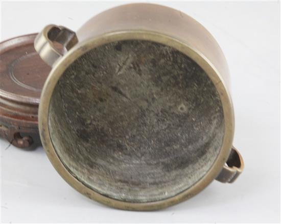 A rare Chinese Ming cylindrical bronze censer, 16th / 17th century, diameter 11cm, wood stand